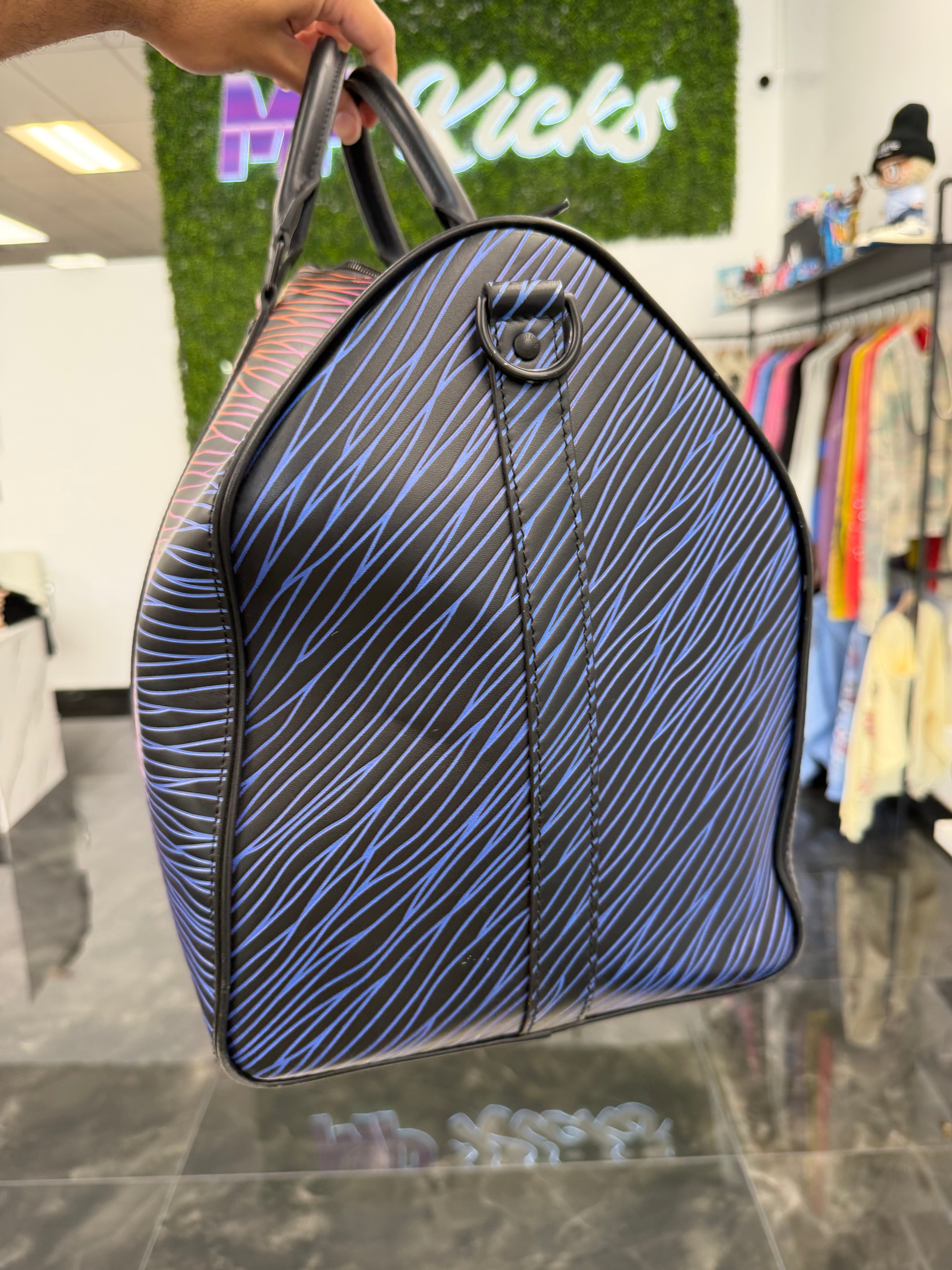 Louis Vuitton Keepall Bandouliere
50 Gradient Electric Sun
